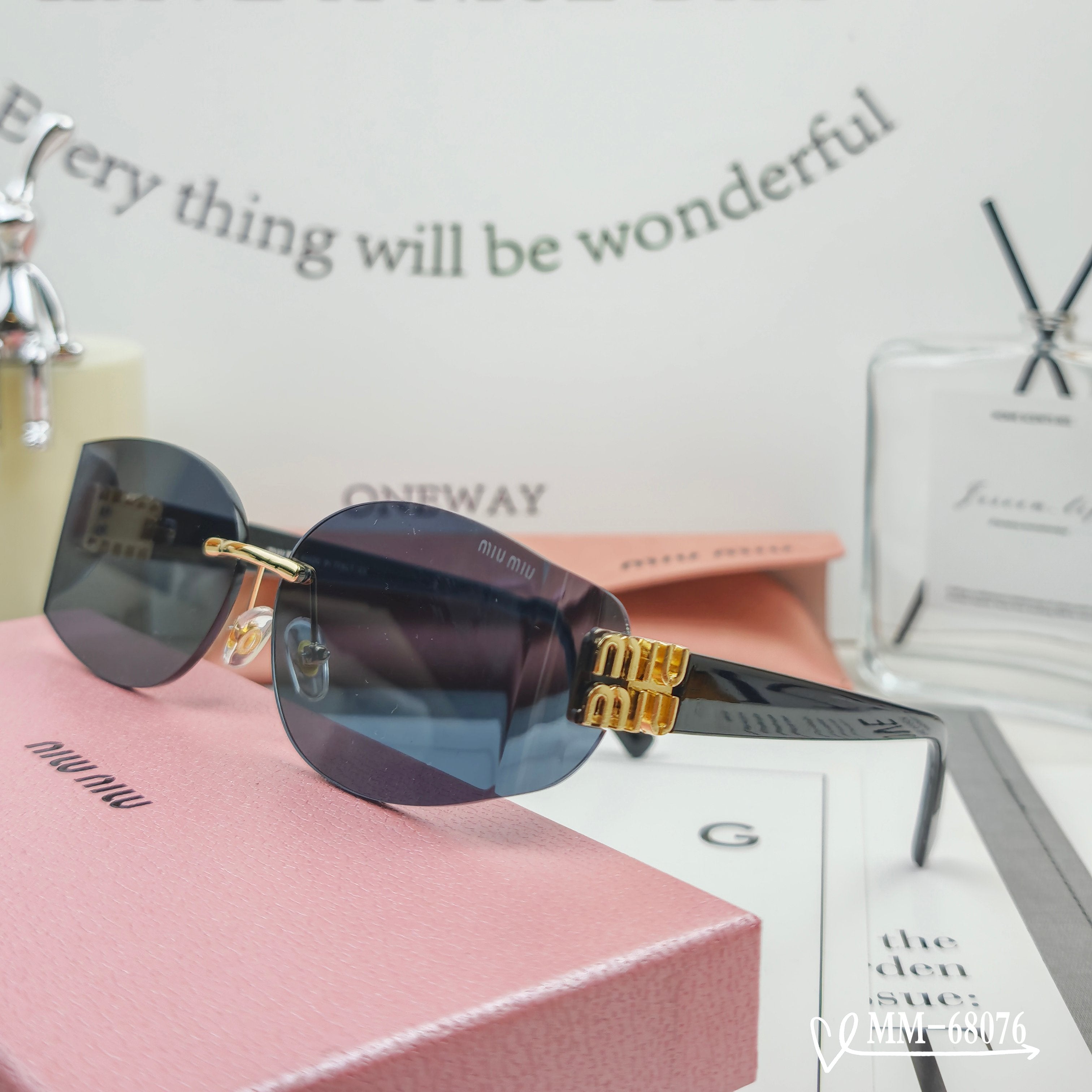 MIUMIU SUNGLASSES LOGO SUNGLASSES 68076 IN BLACK ACETATE