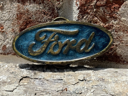 Vintage 1980 Ford blue swirl g Belt Buckle. The Great American Buckle Co.