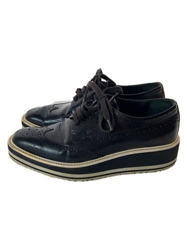 SCARPE ELEGANTI PRADA 37 nere in pelle di mucca usate